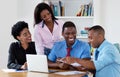 Laughing african american business team talking about strategy Royalty Free Stock Photo