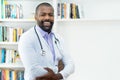 Laughing african american doctor with beard and stethoscope Royalty Free Stock Photo