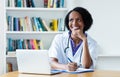 Laughing african american female doctor at work Royalty Free Stock Photo