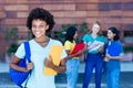 Laughing african american female student with group of students Royalty Free Stock Photo