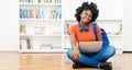 Laughing african american female student learning online at computer with other students Royalty Free Stock Photo
