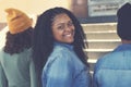 Laughing african american female young adult with group of friends Royalty Free Stock Photo