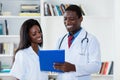 Laughing african american male and female doctor Royalty Free Stock Photo