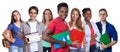 Laughing african american male student with group of students