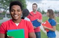 Laughing african american male student with stubble and multiethnic friends Royalty Free Stock Photo
