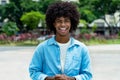 Laughing african american male young adult with afro haistyle Royalty Free Stock Photo