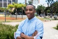 Laughing african american man with crossed arms Royalty Free Stock Photo