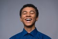 Laughing African American teenager in denim shirt. Royalty Free Stock Photo