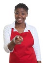 Laughing african american waitress pointing at camera Royalty Free Stock Photo