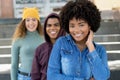 Laughing african american woman with caucasian and hispanic friends in a row Royalty Free Stock Photo