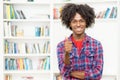 Laughing african american young adult man showing thumb up Royalty Free Stock Photo