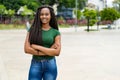 Laughing african american young adult woman with amazing hairstyle Royalty Free Stock Photo