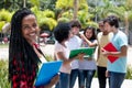 Laughing african female student with group of students Royalty Free Stock Photo