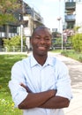 Laughing african man outside with crossed arms Royalty Free Stock Photo