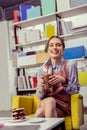 Laughing appealing skinny girl holding warming glass