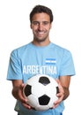 Laughing argentinian man with football Royalty Free Stock Photo