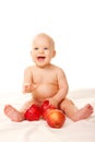 Laughing baby with big red apples Royalty Free Stock Photo