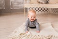 Laughing Baby Boy Lying On Tummy At Home Royalty Free Stock Photo