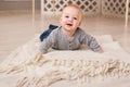 Laughing Baby Boy Lying On Tummy At Home Royalty Free Stock Photo