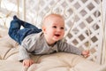 Laughing Baby Boy Lying On Tummy At Home Royalty Free Stock Photo