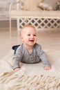 Laughing Baby Boy Lying On Tummy At Home Royalty Free Stock Photo