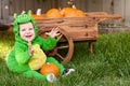 Laughing baby in dragon Halloween costume Royalty Free Stock Photo