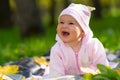 Laughing baby girl with a wide beaming smile. Royalty Free Stock Photo