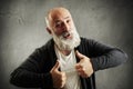 Laughing bearded man showing thumbs up Royalty Free Stock Photo