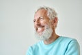 Laughing bearded senior older man isolated standing at white wall. Royalty Free Stock Photo