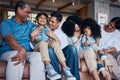 Laughing, big family and on a home sofa for conversation, visit or bonding. Happy, together and parents, children and Royalty Free Stock Photo