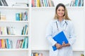 Laughing blond female scientist researching for vaccine against coronavirus