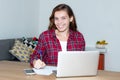 Laughing blond female student working with computer Royalty Free Stock Photo