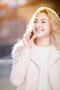 Laughing blonde talking on phone