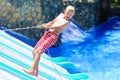 Laughing boy enjoying day in aquapark Royalty Free Stock Photo