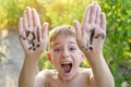 Laughing boy with raised hands written question and exclamation marks. Summer background