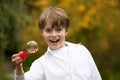 Laughing boy with a soap bubble