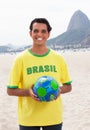 Laughing brazilian sports fan with ball at Rio de Janeiro Royalty Free Stock Photo