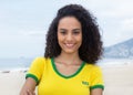 Laughing brazilian sports fan with curly hair at Copacabana beach Royalty Free Stock Photo