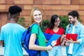 Laughing british female student with group of students Royalty Free Stock Photo