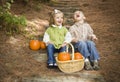 Laughing Brother and Sister Children Sitting on Wood Steps with Pumpkins Royalty Free Stock Photo