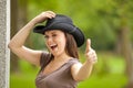 Laughing brunette woman with cowboy hat Royalty Free Stock Photo