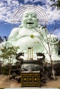 Laughing Buddha statue near Linh An Tu Temple, Dalat in Vietnam