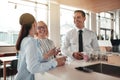 Laughing businesspeople talking during their office coffee break Royalty Free Stock Photo