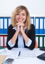 Laughing businesswoman with curly blond hair Royalty Free Stock Photo