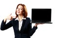 Laughing businesswoman holding laptop and pointing on it Royalty Free Stock Photo