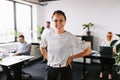 Laughing businesswoman working in an office