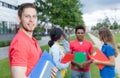 Laughing caucasian male student with stubble and multiethnic friends Royalty Free Stock Photo