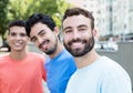 Laughing caucasian man with beard with two friends in the city Royalty Free Stock Photo