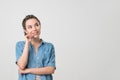 Laughing caucasian woman with braids hairstyle and good sense of humor smiling dreamly Royalty Free Stock Photo