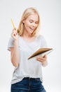 Laughing cheerful pretty girl holding notebook Royalty Free Stock Photo